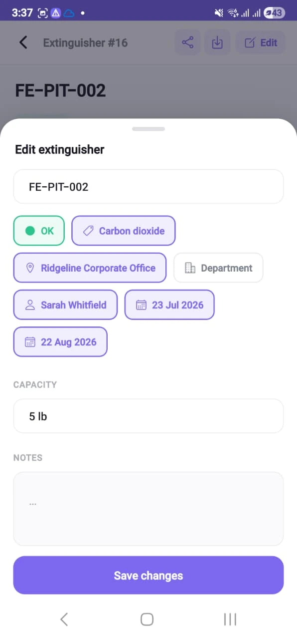 The edit extinguisher sheet on a phone, showing the asset code, status, type, location, custodian, dates, capacity and notes as editable fields